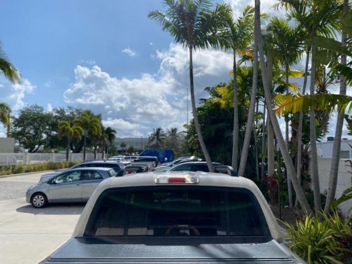 2009 White Suede /Camel Ford Explorer Sport Trac XLT LOW MILES 73,848 (1FMEU31E99U) with an 4.0L SOHC 12-Valve V6 Engine engine, Automatic transmission, located at 4701 North Dixie Hwy, Pompano Beach, FL, 33064, (954) 422-2889, 26.240938, -80.123474 - OUR WEBPAGE FLORIDACARS1.COM HAS OVER 100 PHOTOS AND FREE CARFAX LINK 2009 Ford Explorer Sport Trac XLT Sport Pickup 4.0L V6 F SOHC 12V Gasoline 21 MPG Rear Wheel Drive Features ABS Brakes Air Conditioning Alloy Wheels AM/FM Stereo Automatic Transmission Auxiliary Audio Input CD Audio Cloth Seats Cr - Photo#98