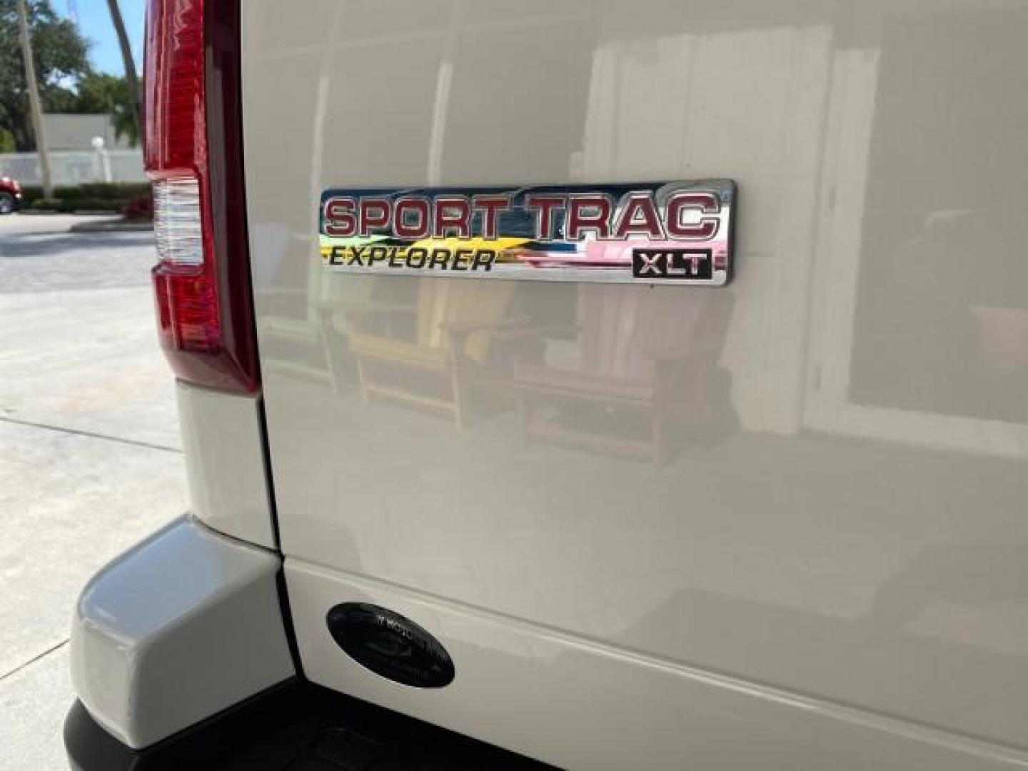 2009 White Suede /Camel Ford Explorer Sport Trac XLT LOW MILES 73,848 (1FMEU31E99U) with an 4.0L SOHC 12-Valve V6 Engine engine, Automatic transmission, located at 4701 North Dixie Hwy, Pompano Beach, FL, 33064, (954) 422-2889, 26.240938, -80.123474 - OUR WEBPAGE FLORIDACARS1.COM HAS OVER 100 PHOTOS AND FREE CARFAX LINK 2009 Ford Explorer Sport Trac XLT Sport Pickup 4.0L V6 F SOHC 12V Gasoline 21 MPG Rear Wheel Drive Features ABS Brakes Air Conditioning Alloy Wheels AM/FM Stereo Automatic Transmission Auxiliary Audio Input CD Audio Cloth Seats Cr - Photo#99