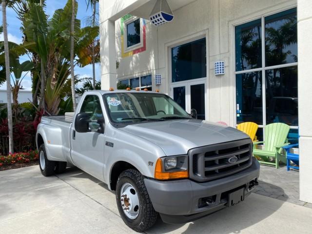2001 Silver Metallic /Medium Graphite Ford Super Duty F-350 DRW DUALLY XL 1 OWNER LOW MILES 14,269 (1FTWF32SX1E) with an 6.8L SOHC SEFI V10 Engine engine, Automatic transmission, located at 4701 North Dixie Hwy, Pompano Beach, FL, 33064, (954) 422-2889, 26.240938, -80.123474 - OUR WEBPAGE FLORIDACARS1.COM HAS OVER 100 PHOTOS AND FREE CARFAX LINK 2001 Ford F-350 Super Duty Dually XL 1 OWNER Pickup 6.8L V10 F SOHC Gasoline Rear Wheel Drive Features ABS Brakes Air Conditioning AM/FM Stereo Automatic Transmission Cassette Player Dual Rear Wheels Long Bed Tow Hitch Vinyl Seats - Photo#1