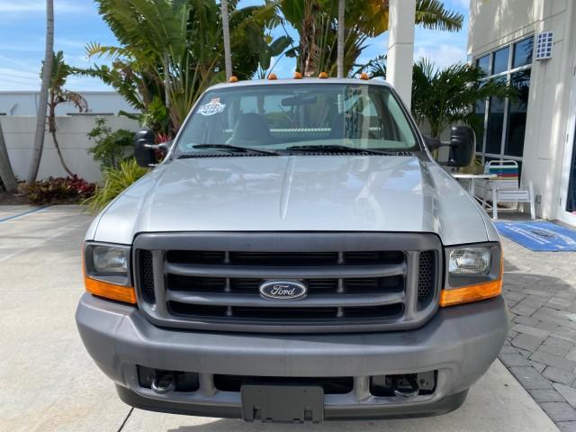 2001 Silver Metallic /Medium Graphite Ford Super Duty F-350 DRW DUALLY XL 1 OWNER LOW MILES 14,269 (1FTWF32SX1E) with an 6.8L SOHC SEFI V10 Engine engine, Automatic transmission, located at 4701 North Dixie Hwy, Pompano Beach, FL, 33064, (954) 422-2889, 26.240938, -80.123474 - OUR WEBPAGE FLORIDACARS1.COM HAS OVER 100 PHOTOS AND FREE CARFAX LINK 2001 Ford F-350 Super Duty Dually XL 1 OWNER Pickup 6.8L V10 F SOHC Gasoline Rear Wheel Drive Features ABS Brakes Air Conditioning AM/FM Stereo Automatic Transmission Cassette Player Dual Rear Wheels Long Bed Tow Hitch Vinyl Seats - Photo#2
