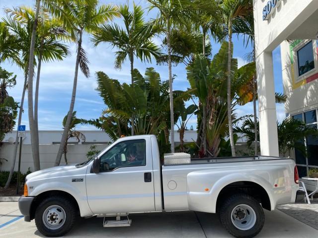 2001 Silver Metallic /Medium Graphite Ford Super Duty F-350 DRW DUALLY XL 1 OWNER LOW MILES 14,269 (1FTWF32SX1E) with an 6.8L SOHC SEFI V10 Engine engine, Automatic transmission, located at 4701 North Dixie Hwy, Pompano Beach, FL, 33064, (954) 422-2889, 26.240938, -80.123474 - OUR WEBPAGE FLORIDACARS1.COM HAS OVER 100 PHOTOS AND FREE CARFAX LINK 2001 Ford F-350 Super Duty Dually XL 1 OWNER Pickup 6.8L V10 F SOHC Gasoline Rear Wheel Drive Features ABS Brakes Air Conditioning AM/FM Stereo Automatic Transmission Cassette Player Dual Rear Wheels Long Bed Tow Hitch Vinyl Seats - Photo#4