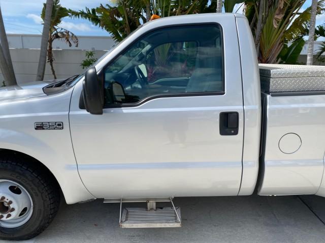 2001 Silver Metallic /Medium Graphite Ford Super Duty F-350 DRW DUALLY XL 1 OWNER LOW MILES 14,269 (1FTWF32SX1E) with an 6.8L SOHC SEFI V10 Engine engine, Automatic transmission, located at 4701 North Dixie Hwy, Pompano Beach, FL, 33064, (954) 422-2889, 26.240938, -80.123474 - OUR WEBPAGE FLORIDACARS1.COM HAS OVER 100 PHOTOS AND FREE CARFAX LINK 2001 Ford F-350 Super Duty Dually XL 1 OWNER Pickup 6.8L V10 F SOHC Gasoline Rear Wheel Drive Features ABS Brakes Air Conditioning AM/FM Stereo Automatic Transmission Cassette Player Dual Rear Wheels Long Bed Tow Hitch Vinyl Seats - Photo#37