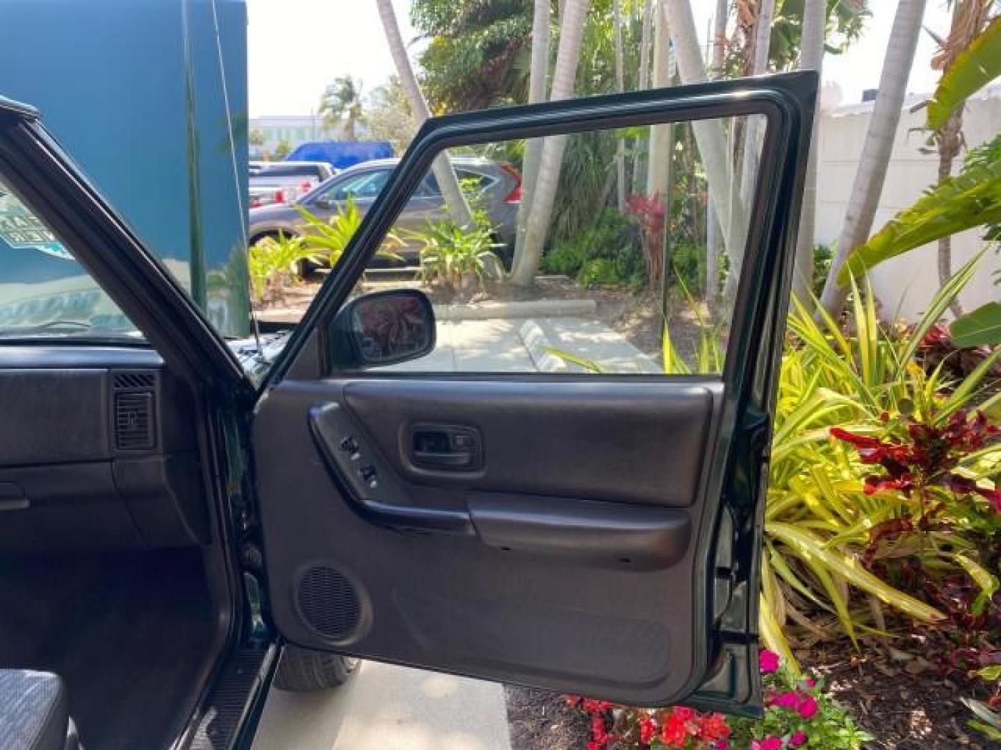 2000 Forest Green Pearl /Agate Jeep Cherokee Sport 1 OWNER 4X4 AC 4.0 6YL (1J4FF48S2YL) with an 4.0L SMFI I6 Power Tech Engine engine, Automatic transmission, located at 4701 North Dixie Hwy, Pompano Beach, FL, 33064, (954) 422-2889, 26.240938, -80.123474 - OUR WEBPAGE FLORIDACARS1.COM HAS OVER 100 PHOTOS AND FREE CARFAX LINK 2000 Jeep Cherokee Sport 4WD 4x4 4 Door Wagon/Sport Utility 4.0L I6 F Gasoline 22 MPG All Wheel Drive Features 4WD/AWD ABS Brakes Air Conditioning AM/FM Stereo Automatic Transmission Cassette Player CD Audio Cloth Seats Cruise Con - Photo#11