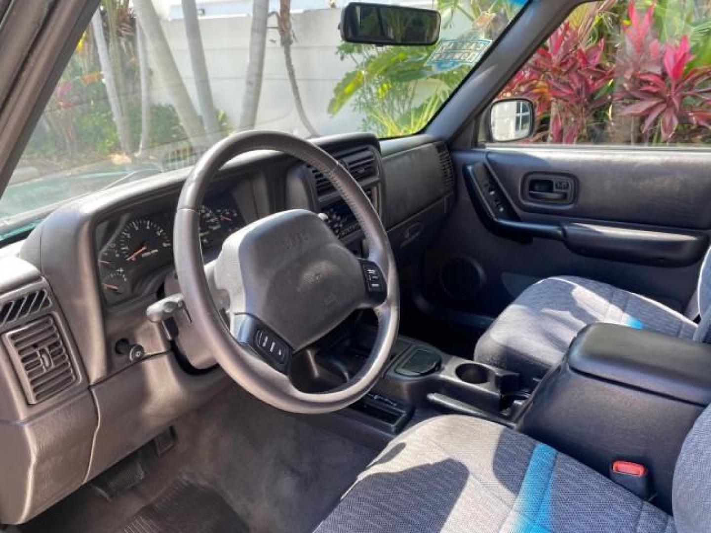 2000 Forest Green Pearl /Agate Jeep Cherokee Sport 1 OWNER 4X4 AC 4.0 6YL (1J4FF48S2YL) with an 4.0L SMFI I6 Power Tech Engine engine, Automatic transmission, located at 4701 North Dixie Hwy, Pompano Beach, FL, 33064, (954) 422-2889, 26.240938, -80.123474 - OUR WEBPAGE FLORIDACARS1.COM HAS OVER 100 PHOTOS AND FREE CARFAX LINK 2000 Jeep Cherokee Sport 4WD 4x4 4 Door Wagon/Sport Utility 4.0L I6 F Gasoline 22 MPG All Wheel Drive Features 4WD/AWD ABS Brakes Air Conditioning AM/FM Stereo Automatic Transmission Cassette Player CD Audio Cloth Seats Cruise Con - Photo#46