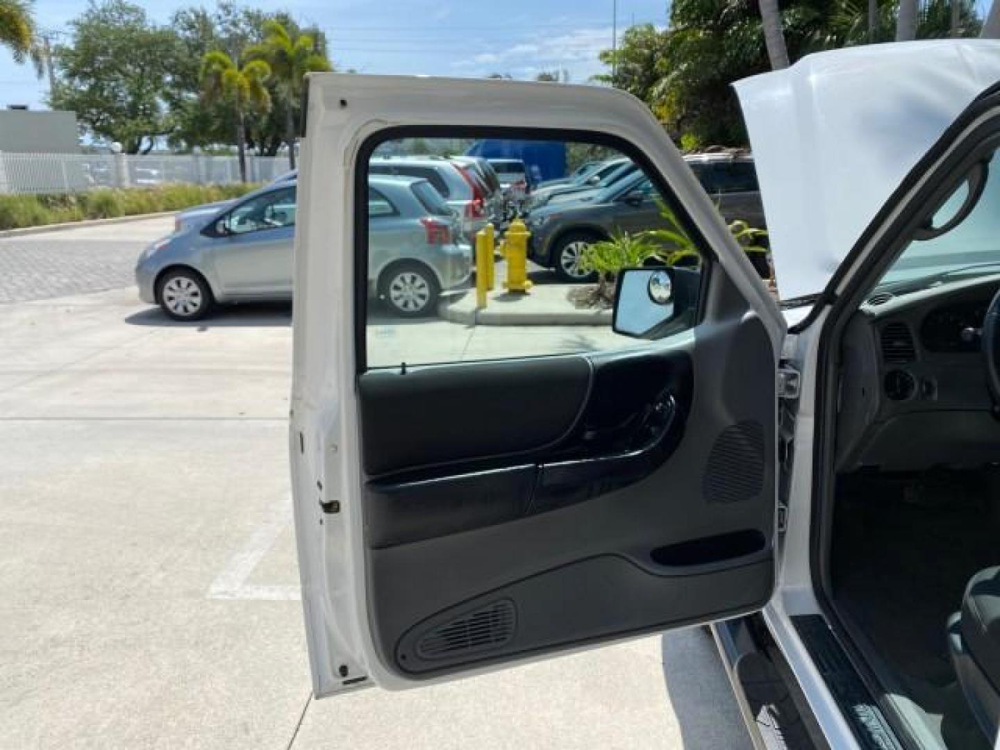 2011 Oxford White /Medium Dark Flint Ford Ranger X CAB XLT LOW MILES 44,686 (1FTKR4EE4BP) with an 4.0L SOHC V6 Engine engine, Automatic transmission, located at 4701 North Dixie Hwy, Pompano Beach, FL, 33064, (954) 422-2889, 26.240938, -80.123474 - OUR WEBPAGE FLORIDACARS1.COM HAS OVER 100 PHOTOS AND FREE CARFAX LINK 2011 Ford Ranger XLT 4 Door Extended Cab Pickup 4.0L V6 F SOHC 16V Gasoline 21 MPG Rear Wheel Drive Features ABS Brakes Air Conditioning AM/FM Stereo Automatic Transmission Auxiliary Audio Input Bed Liner CD Audio Cloth Seats Crui- Photo#9