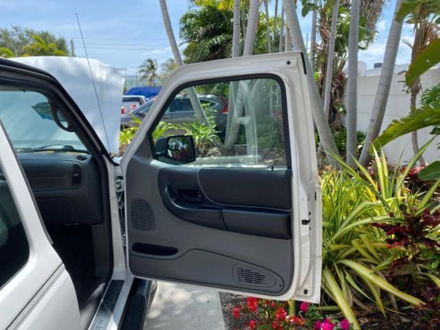 2011 Oxford White /Medium Dark Flint Ford Ranger X CAB XLT LOW MILES 44,686 (1FTKR4EE4BP) with an 4.0L SOHC V6 Engine engine, Automatic transmission, located at 4701 North Dixie Hwy, Pompano Beach, FL, 33064, (954) 422-2889, 26.240938, -80.123474 - OUR WEBPAGE FLORIDACARS1.COM HAS OVER 100 PHOTOS AND FREE CARFAX LINK 2011 Ford Ranger XLT 4 Door Extended Cab Pickup 4.0L V6 F SOHC 16V Gasoline 21 MPG Rear Wheel Drive Features ABS Brakes Air Conditioning AM/FM Stereo Automatic Transmission Auxiliary Audio Input Bed Liner CD Audio Cloth Seats Crui- Photo#11
