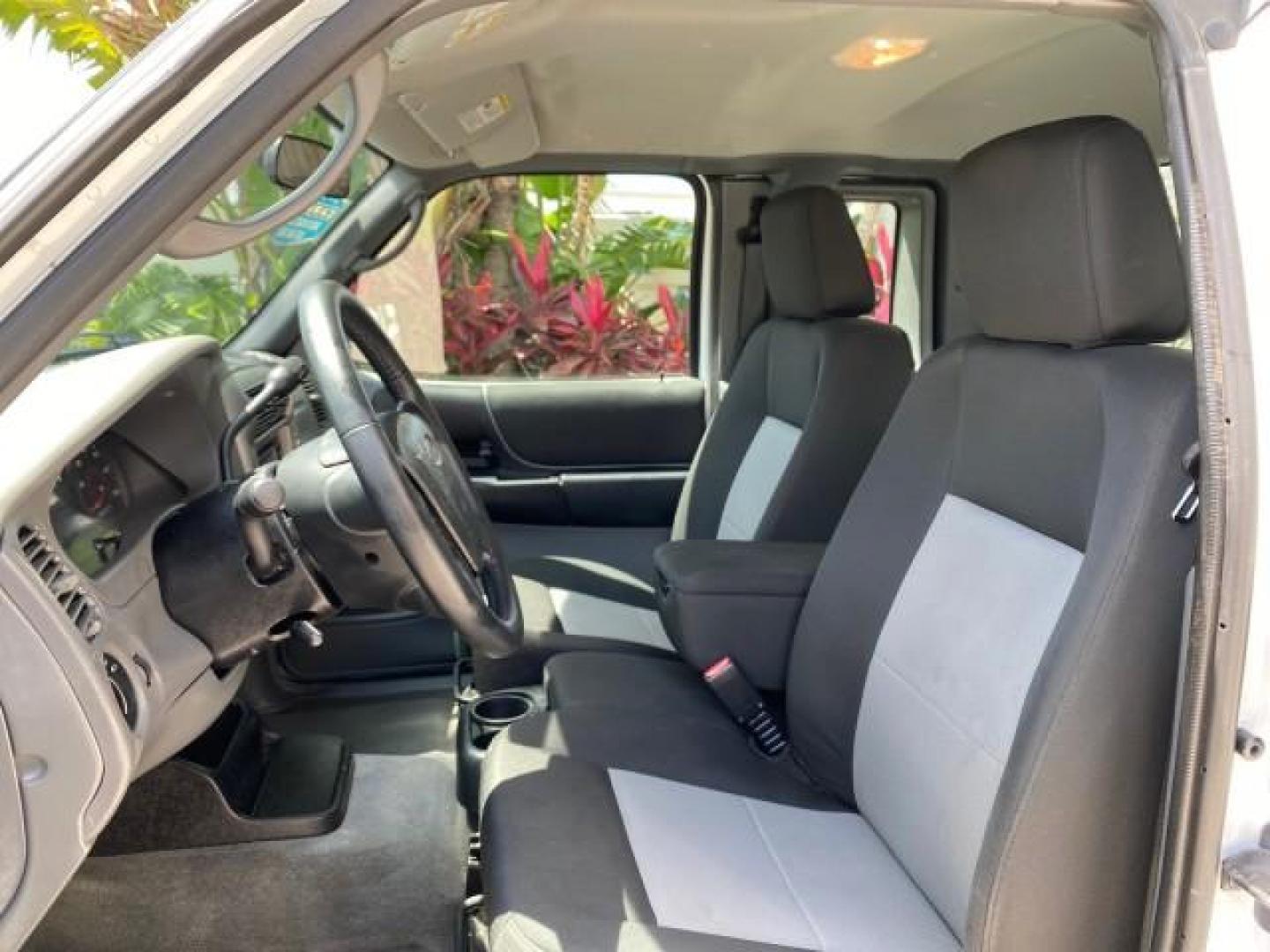 2011 Oxford White /Medium Dark Flint Ford Ranger X CAB XLT LOW MILES 44,686 (1FTKR4EE4BP) with an 4.0L SOHC V6 Engine engine, Automatic transmission, located at 4701 North Dixie Hwy, Pompano Beach, FL, 33064, (954) 422-2889, 26.240938, -80.123474 - OUR WEBPAGE FLORIDACARS1.COM HAS OVER 100 PHOTOS AND FREE CARFAX LINK 2011 Ford Ranger XLT 4 Door Extended Cab Pickup 4.0L V6 F SOHC 16V Gasoline 21 MPG Rear Wheel Drive Features ABS Brakes Air Conditioning AM/FM Stereo Automatic Transmission Auxiliary Audio Input Bed Liner CD Audio Cloth Seats Crui- Photo#46