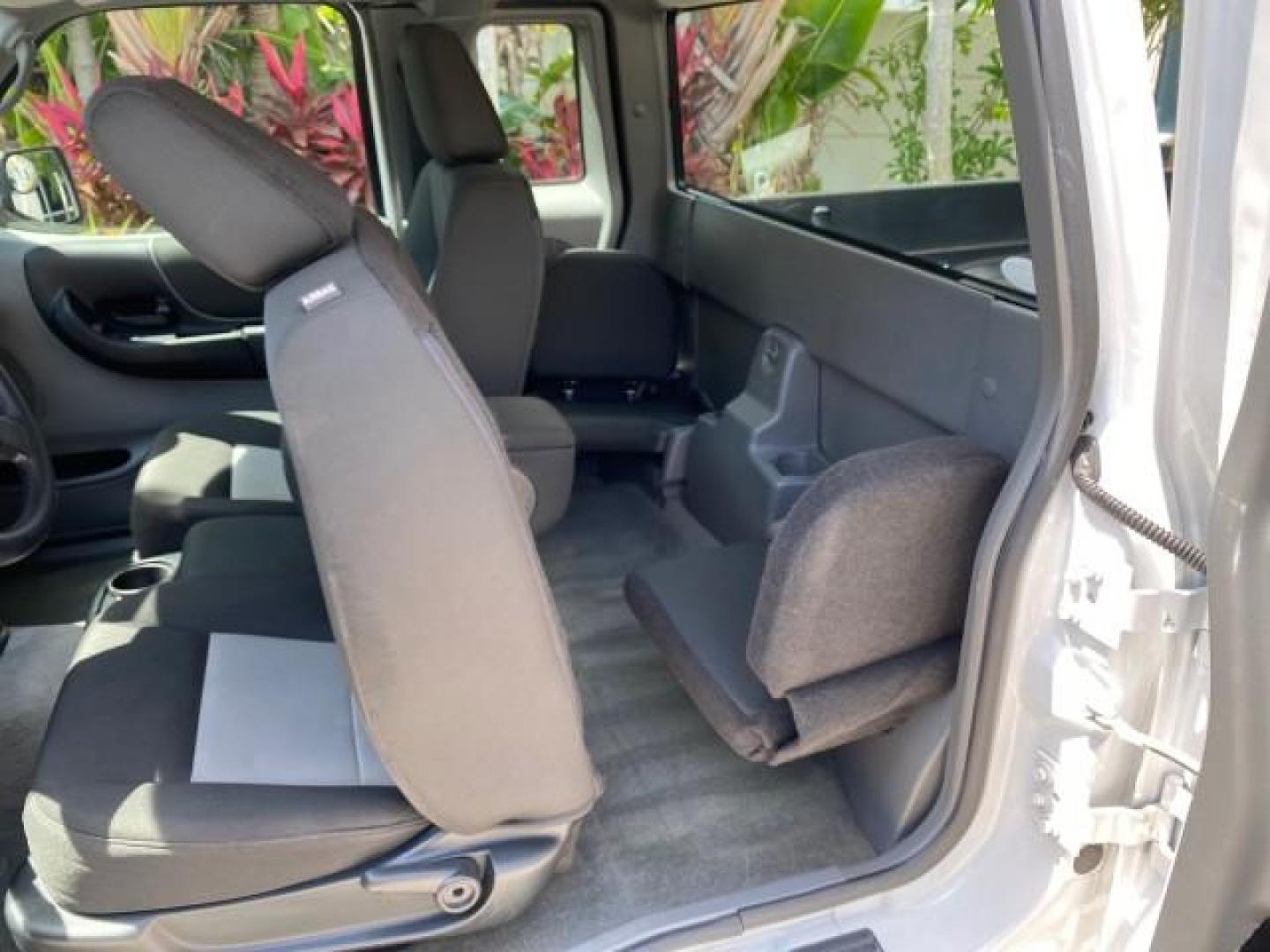2011 Oxford White /Medium Dark Flint Ford Ranger X CAB XLT LOW MILES 44,686 (1FTKR4EE4BP) with an 4.0L SOHC V6 Engine engine, Automatic transmission, located at 4701 North Dixie Hwy, Pompano Beach, FL, 33064, (954) 422-2889, 26.240938, -80.123474 - OUR WEBPAGE FLORIDACARS1.COM HAS OVER 100 PHOTOS AND FREE CARFAX LINK 2011 Ford Ranger XLT 4 Door Extended Cab Pickup 4.0L V6 F SOHC 16V Gasoline 21 MPG Rear Wheel Drive Features ABS Brakes Air Conditioning AM/FM Stereo Automatic Transmission Auxiliary Audio Input Bed Liner CD Audio Cloth Seats Crui- Photo#79