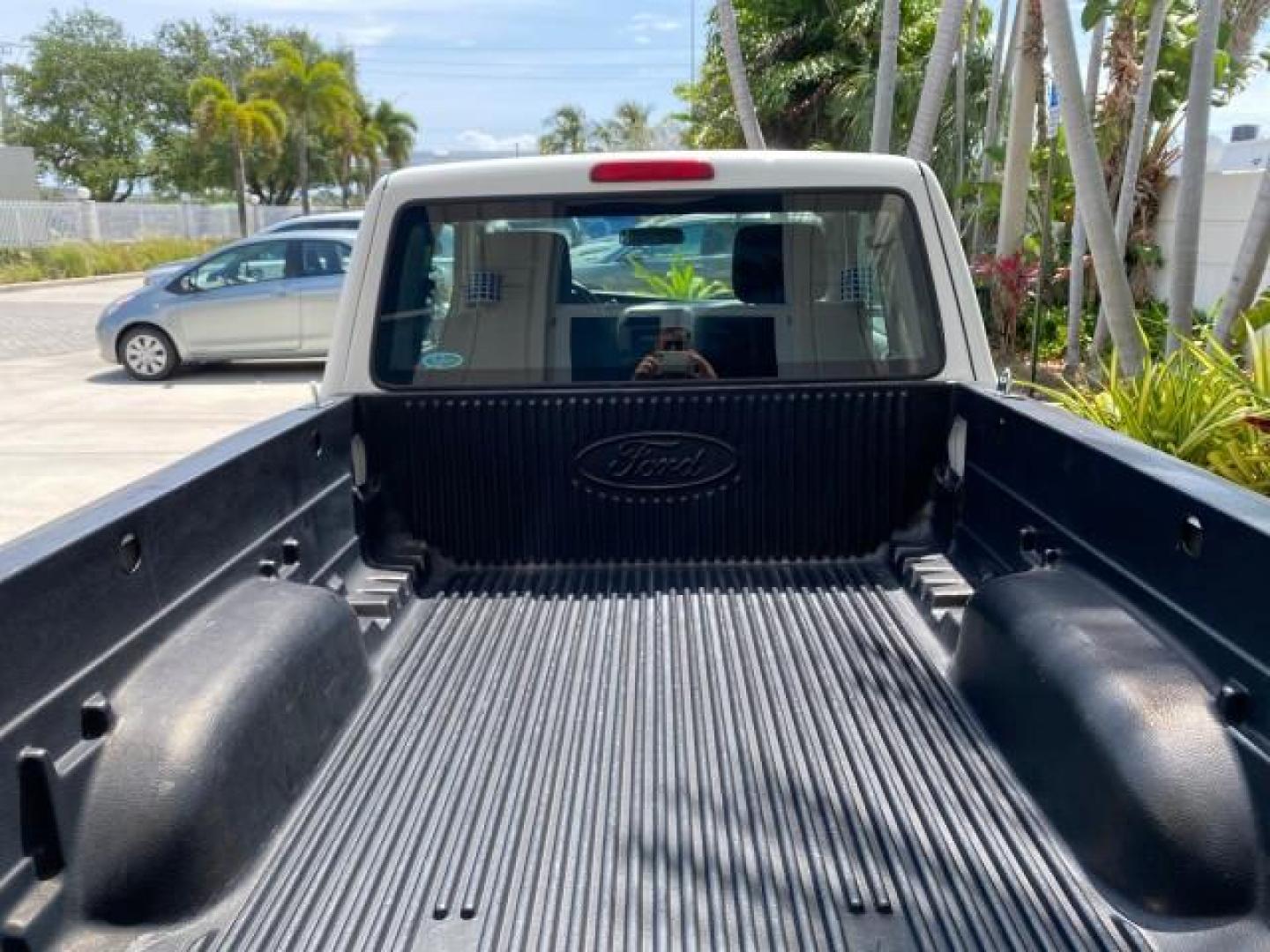 2011 Oxford White /Medium Dark Flint Ford Ranger X CAB XLT LOW MILES 44,686 (1FTKR4EE4BP) with an 4.0L SOHC V6 Engine engine, Automatic transmission, located at 4701 North Dixie Hwy, Pompano Beach, FL, 33064, (954) 422-2889, 26.240938, -80.123474 - OUR WEBPAGE FLORIDACARS1.COM HAS OVER 100 PHOTOS AND FREE CARFAX LINK 2011 Ford Ranger XLT 4 Door Extended Cab Pickup 4.0L V6 F SOHC 16V Gasoline 21 MPG Rear Wheel Drive Features ABS Brakes Air Conditioning AM/FM Stereo Automatic Transmission Auxiliary Audio Input Bed Liner CD Audio Cloth Seats Crui- Photo#96