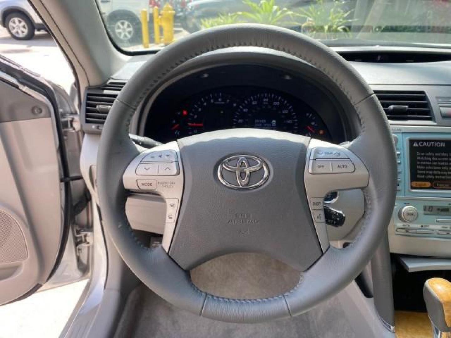 2007 Titanium Metallic /Ash Toyota Camry XLE LOW MILES 15,752 1 OWNER (4T1BK46K37U) with an 3.5L DOHC MPFI VVT-i 24-Valve V6 Engine engine, Automatic transmission, located at 4701 North Dixie Hwy, Pompano Beach, FL, 33064, (954) 422-2889, 26.240938, -80.123474 - OUR WEBPAGE FLORIDACARS1.COM HAS OVER 100 PHOTOS AND FREE CARFAX LINK 2007 Toyota Camry XLE 1 OWNER Sedan 4 DR 3.5L V6 F DOHC 24V Gasoline 31 MPG Front Wheel Drive Features ABS Brakes Air Conditioning Alloy Wheels AM/FM Stereo Automatic Transmission Auxiliary Audio Input Bluetooth Technology CD Audi- Photo#46