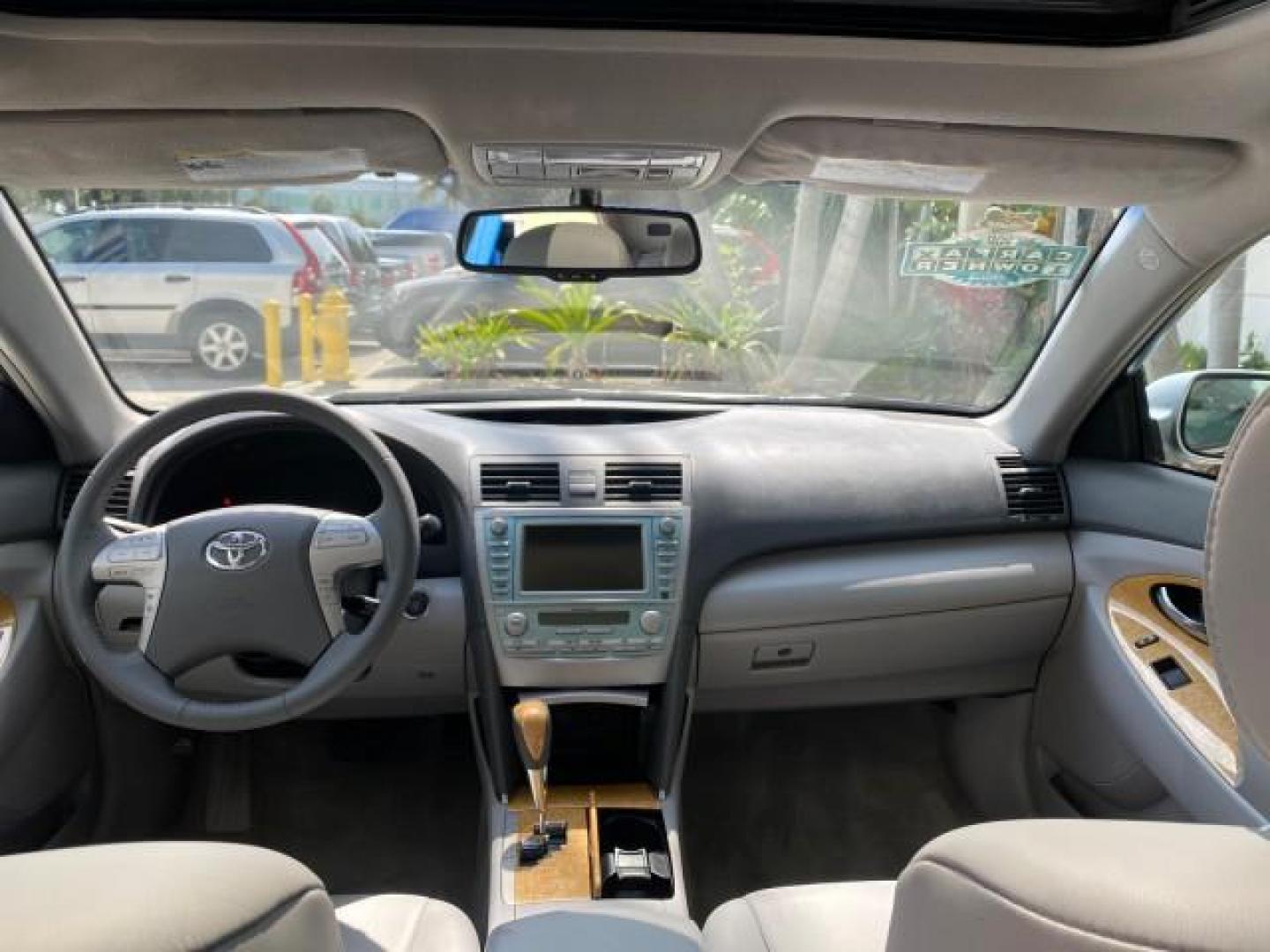 2007 Titanium Metallic /Ash Toyota Camry XLE LOW MILES 15,752 1 OWNER (4T1BK46K37U) with an 3.5L DOHC MPFI VVT-i 24-Valve V6 Engine engine, Automatic transmission, located at 4701 North Dixie Hwy, Pompano Beach, FL, 33064, (954) 422-2889, 26.240938, -80.123474 - OUR WEBPAGE FLORIDACARS1.COM HAS OVER 100 PHOTOS AND FREE CARFAX LINK 2007 Toyota Camry XLE 1 OWNER Sedan 4 DR 3.5L V6 F DOHC 24V Gasoline 31 MPG Front Wheel Drive Features ABS Brakes Air Conditioning Alloy Wheels AM/FM Stereo Automatic Transmission Auxiliary Audio Input Bluetooth Technology CD Audi- Photo#78