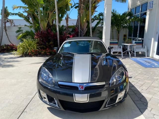 2008 Carbon Flash /Light Titanium Saturn Sky Red Line Carbon Flash SE 5 SPD (1G8MJ35X88Y) with an Turbocharged And Intercooled Ecotec 2.0L VVT DOHC 4-Cyl Aluminum Engine engine, Manual transmission, located at 4701 North Dixie Hwy, Pompano Beach, FL, 33064, (954) 422-2889, 26.240938, -80.123474 - OUR WEBPAGE FLORIDACARS1.COM HAS OVER 100 PHOTOS AND FREE CARFAX LINK 2008 Saturn SKY Red Line Carbon Flash SE Convertible 2.0L I4 F DOHC Gasoline 31 MPG Rear Wheel Drive Features ABS Brakes Air Conditioning Alloy Wheels AM/FM Stereo Auxiliary Audio Input CD Audio Cruise Control Leather Seats Manual - Photo#2