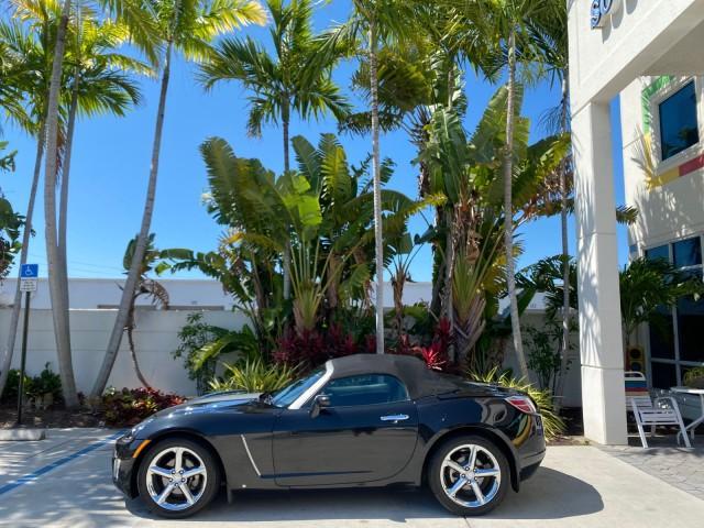 2008 Carbon Flash /Light Titanium Saturn Sky Red Line Carbon Flash SE 5 SPD (1G8MJ35X88Y) with an Turbocharged And Intercooled Ecotec 2.0L VVT DOHC 4-Cyl Aluminum Engine engine, Manual transmission, located at 4701 North Dixie Hwy, Pompano Beach, FL, 33064, (954) 422-2889, 26.240938, -80.123474 - OUR WEBPAGE FLORIDACARS1.COM HAS OVER 100 PHOTOS AND FREE CARFAX LINK 2008 Saturn SKY Red Line Carbon Flash SE Convertible 2.0L I4 F DOHC Gasoline 31 MPG Rear Wheel Drive Features ABS Brakes Air Conditioning Alloy Wheels AM/FM Stereo Auxiliary Audio Input CD Audio Cruise Control Leather Seats Manual - Photo#3