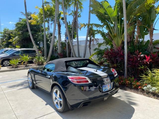 2008 Carbon Flash /Light Titanium Saturn Sky Red Line Carbon Flash SE 5 SPD (1G8MJ35X88Y) with an Turbocharged And Intercooled Ecotec 2.0L VVT DOHC 4-Cyl Aluminum Engine engine, Manual transmission, located at 4701 North Dixie Hwy, Pompano Beach, FL, 33064, (954) 422-2889, 26.240938, -80.123474 - OUR WEBPAGE FLORIDACARS1.COM HAS OVER 100 PHOTOS AND FREE CARFAX LINK 2008 Saturn SKY Red Line Carbon Flash SE Convertible 2.0L I4 F DOHC Gasoline 31 MPG Rear Wheel Drive Features ABS Brakes Air Conditioning Alloy Wheels AM/FM Stereo Auxiliary Audio Input CD Audio Cruise Control Leather Seats Manual - Photo#4