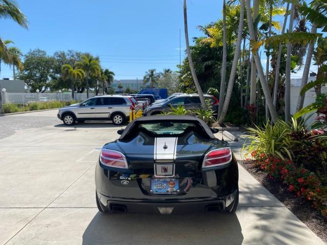 2008 Carbon Flash /Light Titanium Saturn Sky Red Line Carbon Flash SE 5 SPD (1G8MJ35X88Y) with an Turbocharged And Intercooled Ecotec 2.0L VVT DOHC 4-Cyl Aluminum Engine engine, Manual transmission, located at 4701 North Dixie Hwy, Pompano Beach, FL, 33064, (954) 422-2889, 26.240938, -80.123474 - OUR WEBPAGE FLORIDACARS1.COM HAS OVER 100 PHOTOS AND FREE CARFAX LINK 2008 Saturn SKY Red Line Carbon Flash SE Convertible 2.0L I4 F DOHC Gasoline 31 MPG Rear Wheel Drive Features ABS Brakes Air Conditioning Alloy Wheels AM/FM Stereo Auxiliary Audio Input CD Audio Cruise Control Leather Seats Manual - Photo#6