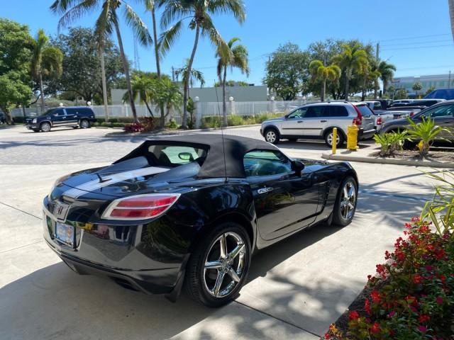 2008 Carbon Flash /Light Titanium Saturn Sky Red Line Carbon Flash SE 5 SPD (1G8MJ35X88Y) with an Turbocharged And Intercooled Ecotec 2.0L VVT DOHC 4-Cyl Aluminum Engine engine, Manual transmission, located at 4701 North Dixie Hwy, Pompano Beach, FL, 33064, (954) 422-2889, 26.240938, -80.123474 - OUR WEBPAGE FLORIDACARS1.COM HAS OVER 100 PHOTOS AND FREE CARFAX LINK 2008 Saturn SKY Red Line Carbon Flash SE Convertible 2.0L I4 F DOHC Gasoline 31 MPG Rear Wheel Drive Features ABS Brakes Air Conditioning Alloy Wheels AM/FM Stereo Auxiliary Audio Input CD Audio Cruise Control Leather Seats Manual - Photo#7