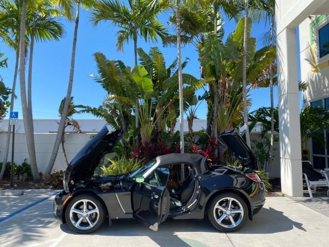 2008 Carbon Flash /Light Titanium Saturn Sky Red Line Carbon Flash SE 5 SPD (1G8MJ35X88Y) with an Turbocharged And Intercooled Ecotec 2.0L VVT DOHC 4-Cyl Aluminum Engine engine, Manual transmission, located at 4701 North Dixie Hwy, Pompano Beach, FL, 33064, (954) 422-2889, 26.240938, -80.123474 - OUR WEBPAGE FLORIDACARS1.COM HAS OVER 100 PHOTOS AND FREE CARFAX LINK 2008 Saturn SKY Red Line Carbon Flash SE Convertible 2.0L I4 F DOHC Gasoline 31 MPG Rear Wheel Drive Features ABS Brakes Air Conditioning Alloy Wheels AM/FM Stereo Auxiliary Audio Input CD Audio Cruise Control Leather Seats Manual - Photo#8