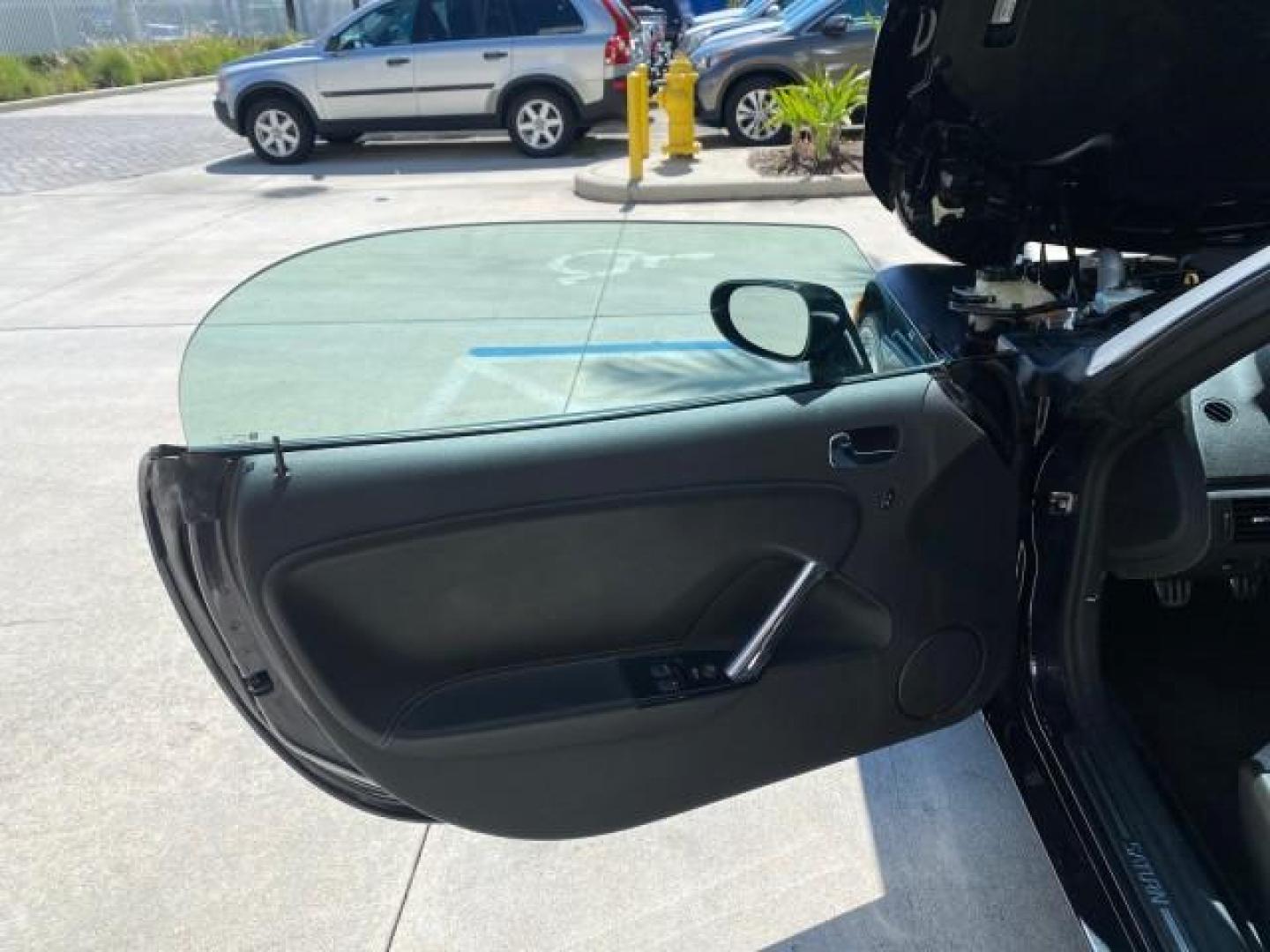 2008 Carbon Flash /Light Titanium Saturn Sky Red Line Carbon Flash SE 5 SPD (1G8MJ35X88Y) with an Turbocharged And Intercooled Ecotec 2.0L VVT DOHC 4-Cyl Aluminum Engine engine, Manual transmission, located at 4701 North Dixie Hwy, Pompano Beach, FL, 33064, (954) 422-2889, 26.240938, -80.123474 - OUR WEBPAGE FLORIDACARS1.COM HAS OVER 100 PHOTOS AND FREE CARFAX LINK 2008 Saturn SKY Red Line Carbon Flash SE Convertible 2.0L I4 F DOHC Gasoline 31 MPG Rear Wheel Drive Features ABS Brakes Air Conditioning Alloy Wheels AM/FM Stereo Auxiliary Audio Input CD Audio Cruise Control Leather Seats Manual - Photo#9