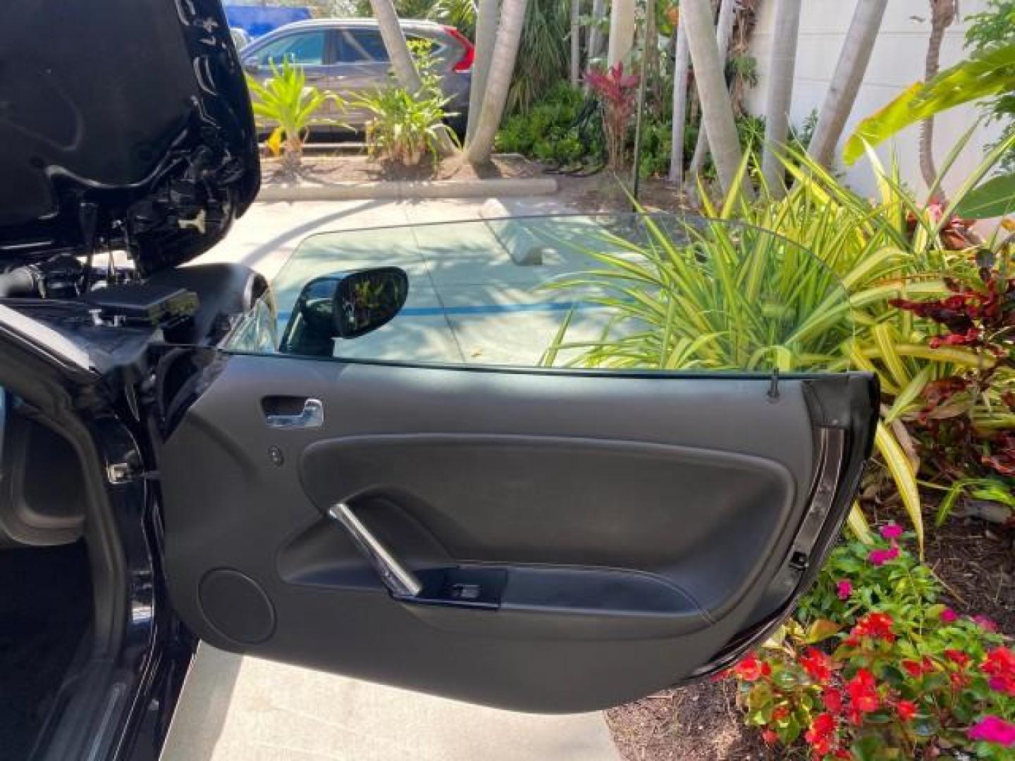 2008 Carbon Flash /Light Titanium Saturn Sky Red Line Carbon Flash SE 5 SPD (1G8MJ35X88Y) with an Turbocharged And Intercooled Ecotec 2.0L VVT DOHC 4-Cyl Aluminum Engine engine, Manual transmission, located at 4701 North Dixie Hwy, Pompano Beach, FL, 33064, (954) 422-2889, 26.240938, -80.123474 - OUR WEBPAGE FLORIDACARS1.COM HAS OVER 100 PHOTOS AND FREE CARFAX LINK 2008 Saturn SKY Red Line Carbon Flash SE Convertible 2.0L I4 F DOHC Gasoline 31 MPG Rear Wheel Drive Features ABS Brakes Air Conditioning Alloy Wheels AM/FM Stereo Auxiliary Audio Input CD Audio Cruise Control Leather Seats Manual - Photo#11