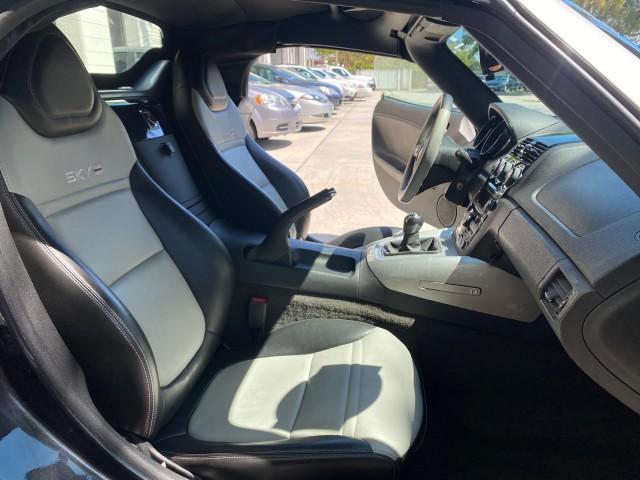 2008 Carbon Flash /Light Titanium Saturn Sky Red Line Carbon Flash SE 5 SPD (1G8MJ35X88Y) with an Turbocharged And Intercooled Ecotec 2.0L VVT DOHC 4-Cyl Aluminum Engine engine, Manual transmission, located at 4701 North Dixie Hwy, Pompano Beach, FL, 33064, (954) 422-2889, 26.240938, -80.123474 - OUR WEBPAGE FLORIDACARS1.COM HAS OVER 100 PHOTOS AND FREE CARFAX LINK 2008 Saturn SKY Red Line Carbon Flash SE Convertible 2.0L I4 F DOHC Gasoline 31 MPG Rear Wheel Drive Features ABS Brakes Air Conditioning Alloy Wheels AM/FM Stereo Auxiliary Audio Input CD Audio Cruise Control Leather Seats Manual - Photo#12