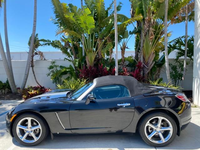 2008 Carbon Flash /Light Titanium Saturn Sky Red Line Carbon Flash SE 5 SPD (1G8MJ35X88Y) with an Turbocharged And Intercooled Ecotec 2.0L VVT DOHC 4-Cyl Aluminum Engine engine, Manual transmission, located at 4701 North Dixie Hwy, Pompano Beach, FL, 33064, (954) 422-2889, 26.240938, -80.123474 - OUR WEBPAGE FLORIDACARS1.COM HAS OVER 100 PHOTOS AND FREE CARFAX LINK 2008 Saturn SKY Red Line Carbon Flash SE Convertible 2.0L I4 F DOHC Gasoline 31 MPG Rear Wheel Drive Features ABS Brakes Air Conditioning Alloy Wheels AM/FM Stereo Auxiliary Audio Input CD Audio Cruise Control Leather Seats Manual - Photo#31
