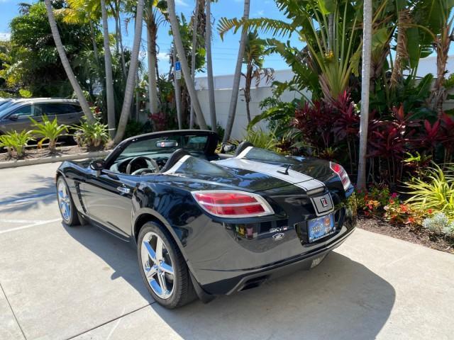 2008 Carbon Flash /Light Titanium Saturn Sky Red Line Carbon Flash SE 5 SPD (1G8MJ35X88Y) with an Turbocharged And Intercooled Ecotec 2.0L VVT DOHC 4-Cyl Aluminum Engine engine, Manual transmission, located at 4701 North Dixie Hwy, Pompano Beach, FL, 33064, (954) 422-2889, 26.240938, -80.123474 - OUR WEBPAGE FLORIDACARS1.COM HAS OVER 100 PHOTOS AND FREE CARFAX LINK 2008 Saturn SKY Red Line Carbon Flash SE Convertible 2.0L I4 F DOHC Gasoline 31 MPG Rear Wheel Drive Features ABS Brakes Air Conditioning Alloy Wheels AM/FM Stereo Auxiliary Audio Input CD Audio Cruise Control Leather Seats Manual - Photo#42
