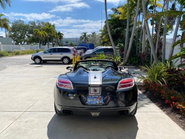 2008 Carbon Flash /Light Titanium Saturn Sky Red Line Carbon Flash SE 5 SPD (1G8MJ35X88Y) with an Turbocharged And Intercooled Ecotec 2.0L VVT DOHC 4-Cyl Aluminum Engine engine, Manual transmission, located at 4701 North Dixie Hwy, Pompano Beach, FL, 33064, (954) 422-2889, 26.240938, -80.123474 - OUR WEBPAGE FLORIDACARS1.COM HAS OVER 100 PHOTOS AND FREE CARFAX LINK 2008 Saturn SKY Red Line Carbon Flash SE Convertible 2.0L I4 F DOHC Gasoline 31 MPG Rear Wheel Drive Features ABS Brakes Air Conditioning Alloy Wheels AM/FM Stereo Auxiliary Audio Input CD Audio Cruise Control Leather Seats Manual - Photo#44