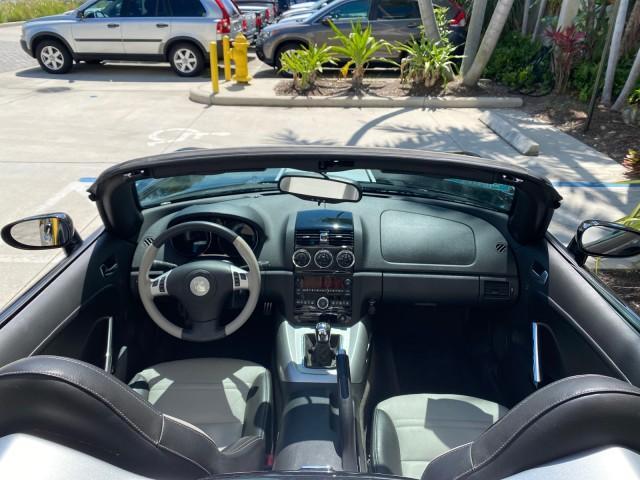 2008 Carbon Flash /Light Titanium Saturn Sky Red Line Carbon Flash SE 5 SPD (1G8MJ35X88Y) with an Turbocharged And Intercooled Ecotec 2.0L VVT DOHC 4-Cyl Aluminum Engine engine, Manual transmission, located at 4701 North Dixie Hwy, Pompano Beach, FL, 33064, (954) 422-2889, 26.240938, -80.123474 - OUR WEBPAGE FLORIDACARS1.COM HAS OVER 100 PHOTOS AND FREE CARFAX LINK 2008 Saturn SKY Red Line Carbon Flash SE Convertible 2.0L I4 F DOHC Gasoline 31 MPG Rear Wheel Drive Features ABS Brakes Air Conditioning Alloy Wheels AM/FM Stereo Auxiliary Audio Input CD Audio Cruise Control Leather Seats Manual - Photo#47
