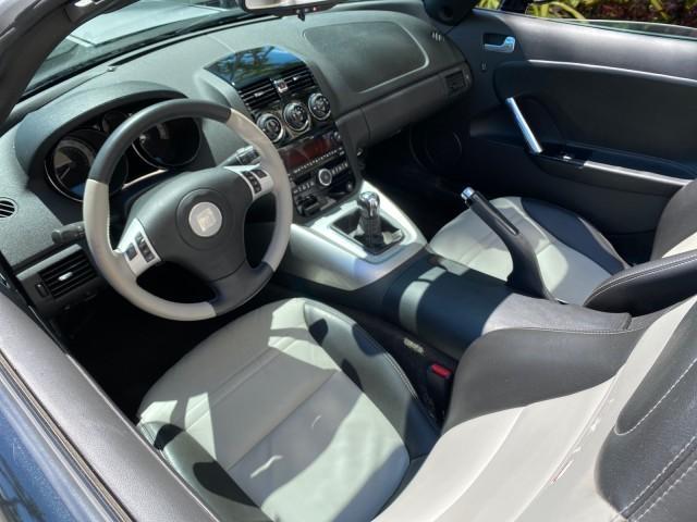 2008 Carbon Flash /Light Titanium Saturn Sky Red Line Carbon Flash SE 5 SPD (1G8MJ35X88Y) with an Turbocharged And Intercooled Ecotec 2.0L VVT DOHC 4-Cyl Aluminum Engine engine, Manual transmission, located at 4701 North Dixie Hwy, Pompano Beach, FL, 33064, (954) 422-2889, 26.240938, -80.123474 - OUR WEBPAGE FLORIDACARS1.COM HAS OVER 100 PHOTOS AND FREE CARFAX LINK 2008 Saturn SKY Red Line Carbon Flash SE Convertible 2.0L I4 F DOHC Gasoline 31 MPG Rear Wheel Drive Features ABS Brakes Air Conditioning Alloy Wheels AM/FM Stereo Auxiliary Audio Input CD Audio Cruise Control Leather Seats Manual - Photo#48