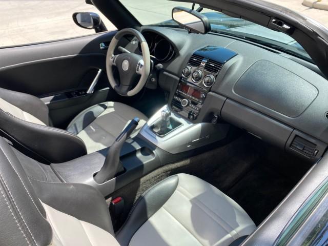 2008 Carbon Flash /Light Titanium Saturn Sky Red Line Carbon Flash SE 5 SPD (1G8MJ35X88Y) with an Turbocharged And Intercooled Ecotec 2.0L VVT DOHC 4-Cyl Aluminum Engine engine, Manual transmission, located at 4701 North Dixie Hwy, Pompano Beach, FL, 33064, (954) 422-2889, 26.240938, -80.123474 - OUR WEBPAGE FLORIDACARS1.COM HAS OVER 100 PHOTOS AND FREE CARFAX LINK 2008 Saturn SKY Red Line Carbon Flash SE Convertible 2.0L I4 F DOHC Gasoline 31 MPG Rear Wheel Drive Features ABS Brakes Air Conditioning Alloy Wheels AM/FM Stereo Auxiliary Audio Input CD Audio Cruise Control Leather Seats Manual - Photo#49