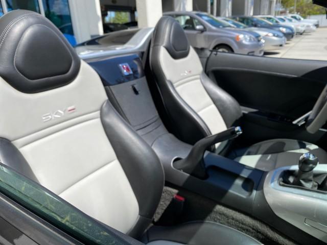 2008 Carbon Flash /Light Titanium Saturn Sky Red Line Carbon Flash SE 5 SPD (1G8MJ35X88Y) with an Turbocharged And Intercooled Ecotec 2.0L VVT DOHC 4-Cyl Aluminum Engine engine, Manual transmission, located at 4701 North Dixie Hwy, Pompano Beach, FL, 33064, (954) 422-2889, 26.240938, -80.123474 - OUR WEBPAGE FLORIDACARS1.COM HAS OVER 100 PHOTOS AND FREE CARFAX LINK 2008 Saturn SKY Red Line Carbon Flash SE Convertible 2.0L I4 F DOHC Gasoline 31 MPG Rear Wheel Drive Features ABS Brakes Air Conditioning Alloy Wheels AM/FM Stereo Auxiliary Audio Input CD Audio Cruise Control Leather Seats Manual - Photo#53