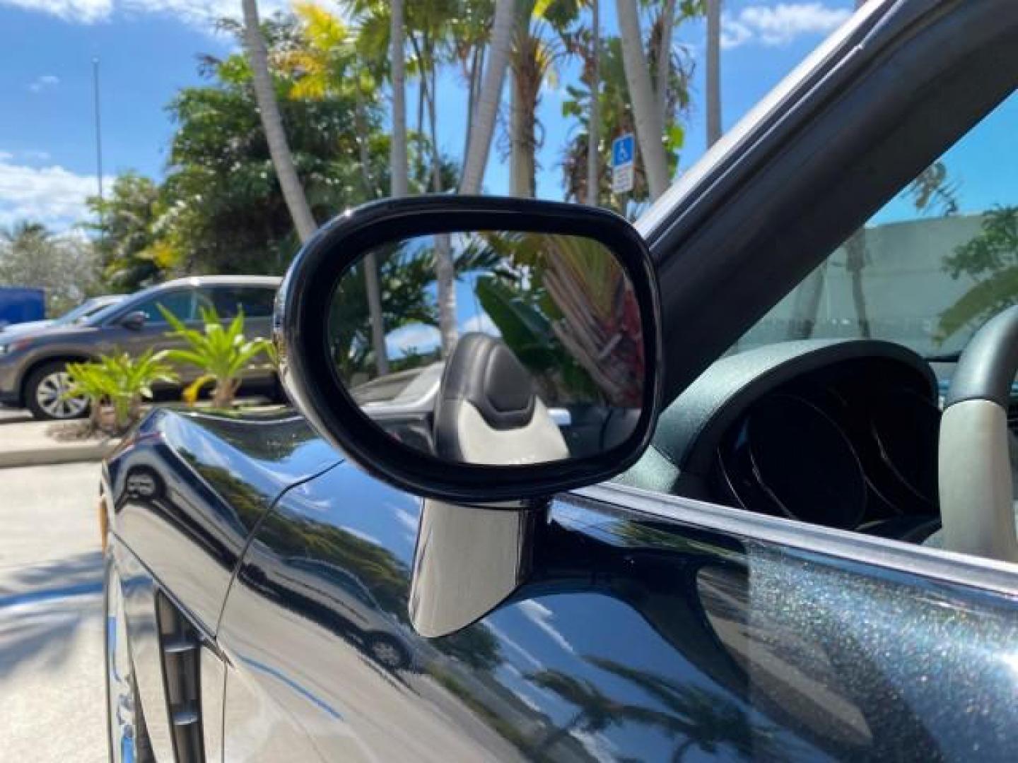 2008 Carbon Flash /Light Titanium Saturn Sky Red Line Carbon Flash SE 5 SPD (1G8MJ35X88Y) with an Turbocharged And Intercooled Ecotec 2.0L VVT DOHC 4-Cyl Aluminum Engine engine, Manual transmission, located at 4701 North Dixie Hwy, Pompano Beach, FL, 33064, (954) 422-2889, 26.240938, -80.123474 - OUR WEBPAGE FLORIDACARS1.COM HAS OVER 100 PHOTOS AND FREE CARFAX LINK 2008 Saturn SKY Red Line Carbon Flash SE Convertible 2.0L I4 F DOHC Gasoline 31 MPG Rear Wheel Drive Features ABS Brakes Air Conditioning Alloy Wheels AM/FM Stereo Auxiliary Audio Input CD Audio Cruise Control Leather Seats Manual - Photo#57
