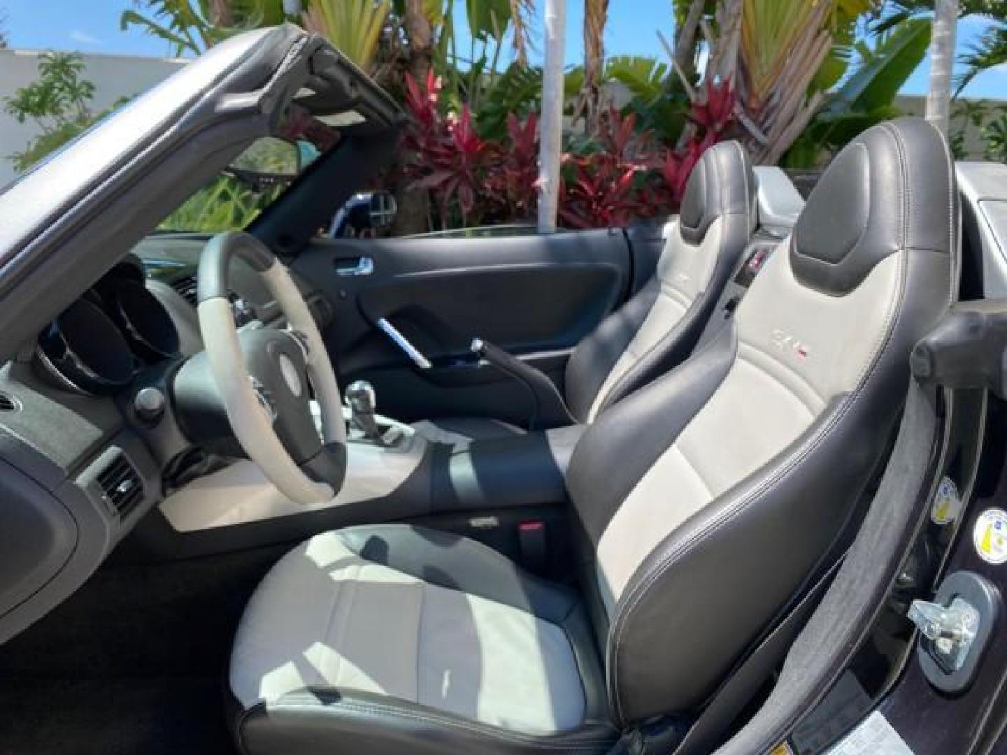 2008 Carbon Flash /Light Titanium Saturn Sky Red Line Carbon Flash SE 5 SPD (1G8MJ35X88Y) with an Turbocharged And Intercooled Ecotec 2.0L VVT DOHC 4-Cyl Aluminum Engine engine, Manual transmission, located at 4701 North Dixie Hwy, Pompano Beach, FL, 33064, (954) 422-2889, 26.240938, -80.123474 - OUR WEBPAGE FLORIDACARS1.COM HAS OVER 100 PHOTOS AND FREE CARFAX LINK 2008 Saturn SKY Red Line Carbon Flash SE Convertible 2.0L I4 F DOHC Gasoline 31 MPG Rear Wheel Drive Features ABS Brakes Air Conditioning Alloy Wheels AM/FM Stereo Auxiliary Audio Input CD Audio Cruise Control Leather Seats Manual - Photo#63