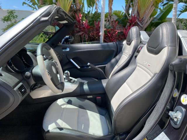 2008 Carbon Flash /Light Titanium Saturn Sky Red Line Carbon Flash SE 5 SPD (1G8MJ35X88Y) with an Turbocharged And Intercooled Ecotec 2.0L VVT DOHC 4-Cyl Aluminum Engine engine, Manual transmission, located at 4701 North Dixie Hwy, Pompano Beach, FL, 33064, (954) 422-2889, 26.240938, -80.123474 - OUR WEBPAGE FLORIDACARS1.COM HAS OVER 100 PHOTOS AND FREE CARFAX LINK 2008 Saturn SKY Red Line Carbon Flash SE Convertible 2.0L I4 F DOHC Gasoline 31 MPG Rear Wheel Drive Features ABS Brakes Air Conditioning Alloy Wheels AM/FM Stereo Auxiliary Audio Input CD Audio Cruise Control Leather Seats Manual - Photo#63