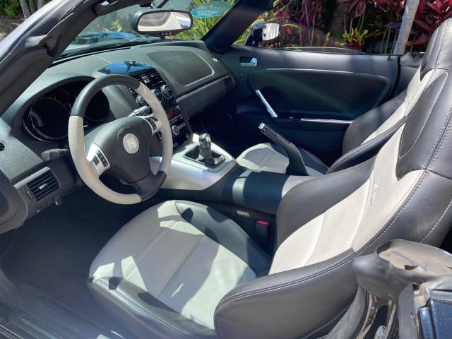 2008 Carbon Flash /Light Titanium Saturn Sky Red Line Carbon Flash SE 5 SPD (1G8MJ35X88Y) with an Turbocharged And Intercooled Ecotec 2.0L VVT DOHC 4-Cyl Aluminum Engine engine, Manual transmission, located at 4701 North Dixie Hwy, Pompano Beach, FL, 33064, (954) 422-2889, 26.240938, -80.123474 - OUR WEBPAGE FLORIDACARS1.COM HAS OVER 100 PHOTOS AND FREE CARFAX LINK 2008 Saturn SKY Red Line Carbon Flash SE Convertible 2.0L I4 F DOHC Gasoline 31 MPG Rear Wheel Drive Features ABS Brakes Air Conditioning Alloy Wheels AM/FM Stereo Auxiliary Audio Input CD Audio Cruise Control Leather Seats Manual - Photo#65
