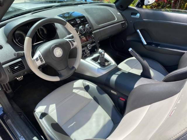 2008 Carbon Flash /Light Titanium Saturn Sky Red Line Carbon Flash SE 5 SPD (1G8MJ35X88Y) with an Turbocharged And Intercooled Ecotec 2.0L VVT DOHC 4-Cyl Aluminum Engine engine, Manual transmission, located at 4701 North Dixie Hwy, Pompano Beach, FL, 33064, (954) 422-2889, 26.240938, -80.123474 - OUR WEBPAGE FLORIDACARS1.COM HAS OVER 100 PHOTOS AND FREE CARFAX LINK 2008 Saturn SKY Red Line Carbon Flash SE Convertible 2.0L I4 F DOHC Gasoline 31 MPG Rear Wheel Drive Features ABS Brakes Air Conditioning Alloy Wheels AM/FM Stereo Auxiliary Audio Input CD Audio Cruise Control Leather Seats Manual - Photo#66