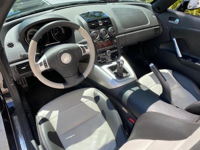 2008 Carbon Flash /Light Titanium Saturn Sky Red Line Carbon Flash SE 5 SPD (1G8MJ35X88Y) with an Turbocharged And Intercooled Ecotec 2.0L VVT DOHC 4-Cyl Aluminum Engine engine, Manual transmission, located at 4701 North Dixie Hwy, Pompano Beach, FL, 33064, (954) 422-2889, 26.240938, -80.123474 - OUR WEBPAGE FLORIDACARS1.COM HAS OVER 100 PHOTOS AND FREE CARFAX LINK 2008 Saturn SKY Red Line Carbon Flash SE Convertible 2.0L I4 F DOHC Gasoline 31 MPG Rear Wheel Drive Features ABS Brakes Air Conditioning Alloy Wheels AM/FM Stereo Auxiliary Audio Input CD Audio Cruise Control Leather Seats Manual - Photo#67