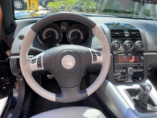 2008 Carbon Flash /Light Titanium Saturn Sky Red Line Carbon Flash SE 5 SPD (1G8MJ35X88Y) with an Turbocharged And Intercooled Ecotec 2.0L VVT DOHC 4-Cyl Aluminum Engine engine, Manual transmission, located at 4701 North Dixie Hwy, Pompano Beach, FL, 33064, (954) 422-2889, 26.240938, -80.123474 - OUR WEBPAGE FLORIDACARS1.COM HAS OVER 100 PHOTOS AND FREE CARFAX LINK 2008 Saturn SKY Red Line Carbon Flash SE Convertible 2.0L I4 F DOHC Gasoline 31 MPG Rear Wheel Drive Features ABS Brakes Air Conditioning Alloy Wheels AM/FM Stereo Auxiliary Audio Input CD Audio Cruise Control Leather Seats Manual - Photo#68
