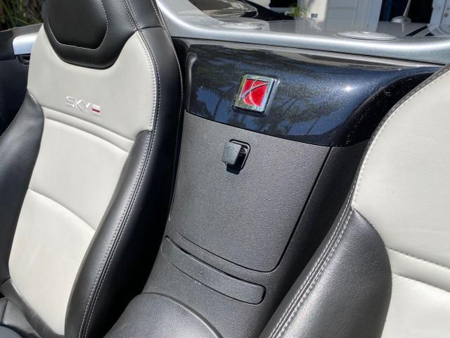 2008 Carbon Flash /Light Titanium Saturn Sky Red Line Carbon Flash SE 5 SPD (1G8MJ35X88Y) with an Turbocharged And Intercooled Ecotec 2.0L VVT DOHC 4-Cyl Aluminum Engine engine, Manual transmission, located at 4701 North Dixie Hwy, Pompano Beach, FL, 33064, (954) 422-2889, 26.240938, -80.123474 - OUR WEBPAGE FLORIDACARS1.COM HAS OVER 100 PHOTOS AND FREE CARFAX LINK 2008 Saturn SKY Red Line Carbon Flash SE Convertible 2.0L I4 F DOHC Gasoline 31 MPG Rear Wheel Drive Features ABS Brakes Air Conditioning Alloy Wheels AM/FM Stereo Auxiliary Audio Input CD Audio Cruise Control Leather Seats Manual - Photo#85