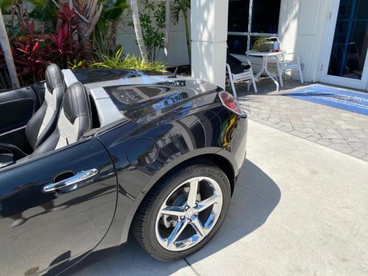 2008 Carbon Flash /Light Titanium Saturn Sky Red Line Carbon Flash SE 5 SPD (1G8MJ35X88Y) with an Turbocharged And Intercooled Ecotec 2.0L VVT DOHC 4-Cyl Aluminum Engine engine, Manual transmission, located at 4701 North Dixie Hwy, Pompano Beach, FL, 33064, (954) 422-2889, 26.240938, -80.123474 - OUR WEBPAGE FLORIDACARS1.COM HAS OVER 100 PHOTOS AND FREE CARFAX LINK 2008 Saturn SKY Red Line Carbon Flash SE Convertible 2.0L I4 F DOHC Gasoline 31 MPG Rear Wheel Drive Features ABS Brakes Air Conditioning Alloy Wheels AM/FM Stereo Auxiliary Audio Input CD Audio Cruise Control Leather Seats Manual - Photo#95