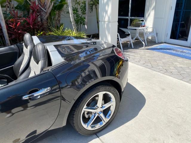 2008 Carbon Flash /Light Titanium Saturn Sky Red Line Carbon Flash SE 5 SPD (1G8MJ35X88Y) with an Turbocharged And Intercooled Ecotec 2.0L VVT DOHC 4-Cyl Aluminum Engine engine, Manual transmission, located at 4701 North Dixie Hwy, Pompano Beach, FL, 33064, (954) 422-2889, 26.240938, -80.123474 - OUR WEBPAGE FLORIDACARS1.COM HAS OVER 100 PHOTOS AND FREE CARFAX LINK 2008 Saturn SKY Red Line Carbon Flash SE Convertible 2.0L I4 F DOHC Gasoline 31 MPG Rear Wheel Drive Features ABS Brakes Air Conditioning Alloy Wheels AM/FM Stereo Auxiliary Audio Input CD Audio Cruise Control Leather Seats Manual - Photo#95