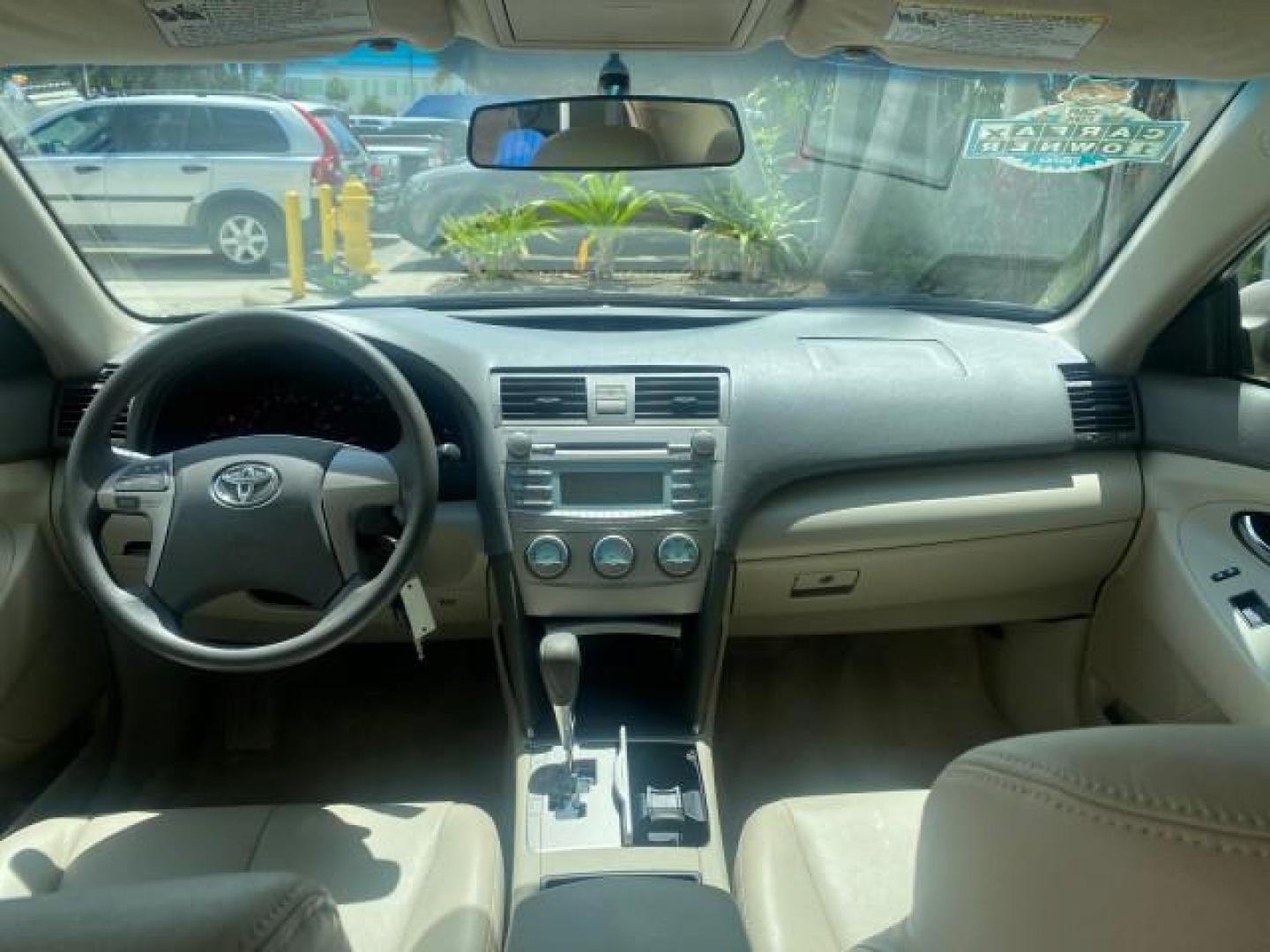 2009 Desert Sand Metallic /Bisque Toyota Camry LE LOW MILES 18,727 1 OWNER (4T1BE46K59U) with an 2.4L DOHC VVT-i 16-Valve 4-Cyl Engine engine, Automatic transmission, located at 4701 North Dixie Hwy, Pompano Beach, FL, 33064, (954) 422-2889, 26.240938, -80.123474 - OUR WEBPAGE FLORIDACARS1.COM HAS OVER 100 PHOTOS AND FREE CARFAX LINK 2009 Toyota Camry LE 1 OWNER Sedan 4 DR 2.4L I4 F DOHC 16V Gasoline 31 MPG Front Wheel Drive Features ABS Brakes Air Conditioning AM/FM Stereo Automatic Transmission Auxiliary Audio Input CD Audio Cruise Control Leather Seats Over - Photo#80