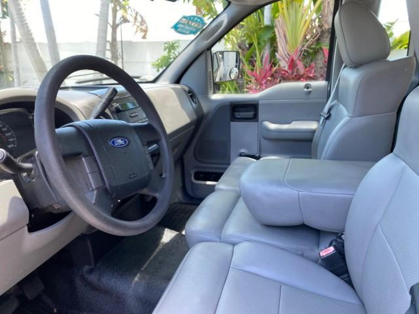 2005 Oxford White /Flint Ford F-150 PU STX LOW MILES 18,931 (1FTRF12215N) with an 4.2L EFI V6 Engine engine, Automatic transmission, located at 4701 North Dixie Hwy, Pompano Beach, FL, 33064, (954) 422-2889, 26.240938, -80.123474 - OUR WEBPAGE FLORIDACARS1.COM HAS OVER 100 PHOTOS AND FREE CARFAX LINK 2005 Ford F-150 STX Pickup 4.2L V6 F OHV Gasoline 20 MPG Rear Wheel Drive Features ABS Brakes Air Conditioning AM/FM Stereo Automatic Transmission Overhead Airbags Side Airbags Traction Control Vinyl Seats 2005 Ford F-150 STX Regu- Photo#42