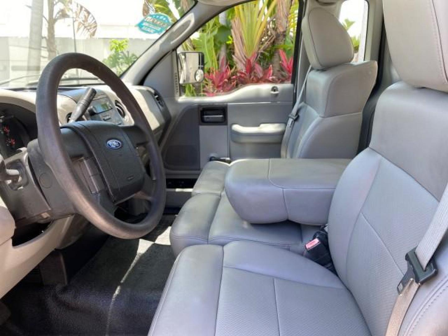 2005 Oxford White /Flint Ford F-150 PU STX LOW MILES 18,931 (1FTRF12215N) with an 4.2L EFI V6 Engine engine, Automatic transmission, located at 4701 North Dixie Hwy, Pompano Beach, FL, 33064, (954) 422-2889, 26.240938, -80.123474 - OUR WEBPAGE FLORIDACARS1.COM HAS OVER 100 PHOTOS AND FREE CARFAX LINK 2005 Ford F-150 STX Pickup 4.2L V6 F OHV Gasoline 20 MPG Rear Wheel Drive Features ABS Brakes Air Conditioning AM/FM Stereo Automatic Transmission Overhead Airbags Side Airbags Traction Control Vinyl Seats 2005 Ford F-150 STX Regu- Photo#46