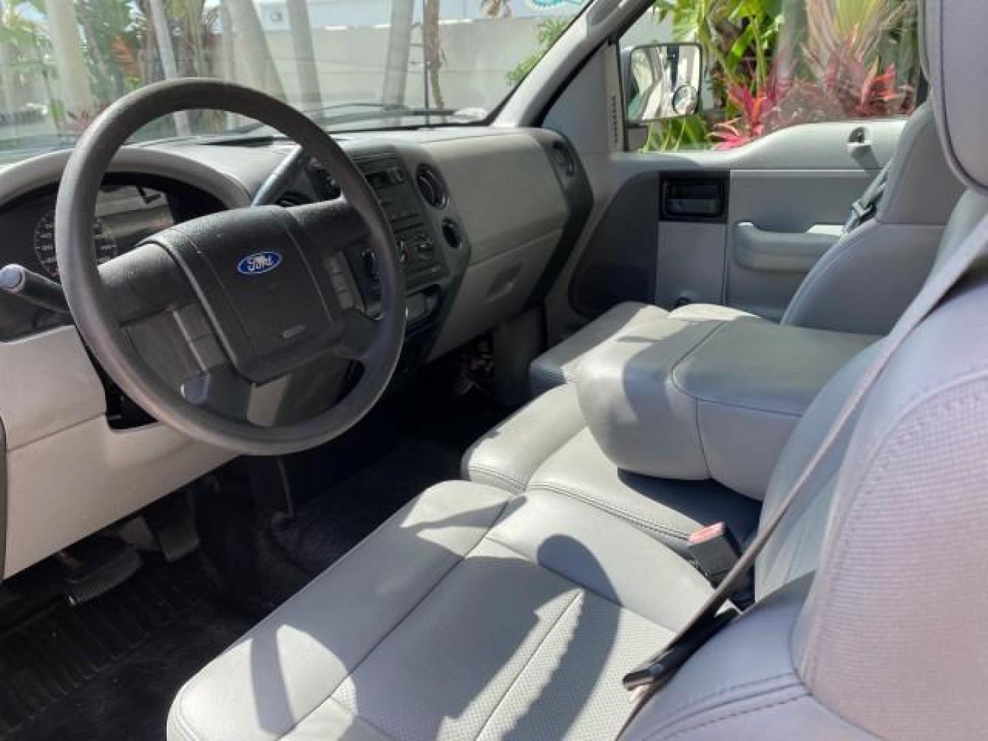 2005 Oxford White /Flint Ford F-150 PU STX LOW MILES 18,931 (1FTRF12215N) with an 4.2L EFI V6 Engine engine, Automatic transmission, located at 4701 North Dixie Hwy, Pompano Beach, FL, 33064, (954) 422-2889, 26.240938, -80.123474 - OUR WEBPAGE FLORIDACARS1.COM HAS OVER 100 PHOTOS AND FREE CARFAX LINK 2005 Ford F-150 STX Pickup 4.2L V6 F OHV Gasoline 20 MPG Rear Wheel Drive Features ABS Brakes Air Conditioning AM/FM Stereo Automatic Transmission Overhead Airbags Side Airbags Traction Control Vinyl Seats 2005 Ford F-150 STX Regu- Photo#47