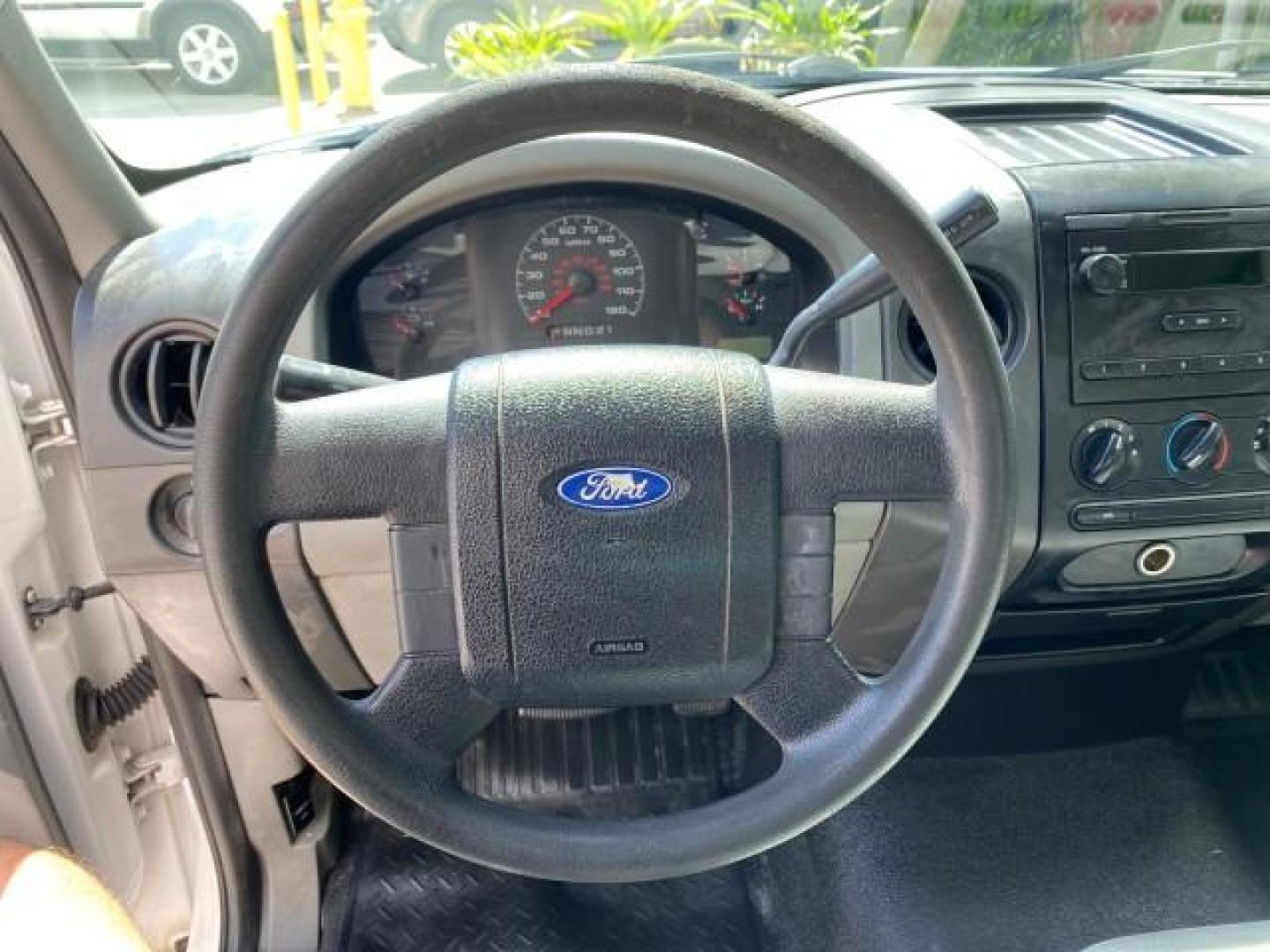 2005 Oxford White /Flint Ford F-150 PU STX LOW MILES 18,931 (1FTRF12215N) with an 4.2L EFI V6 Engine engine, Automatic transmission, located at 4701 North Dixie Hwy, Pompano Beach, FL, 33064, (954) 422-2889, 26.240938, -80.123474 - OUR WEBPAGE FLORIDACARS1.COM HAS OVER 100 PHOTOS AND FREE CARFAX LINK 2005 Ford F-150 STX Pickup 4.2L V6 F OHV Gasoline 20 MPG Rear Wheel Drive Features ABS Brakes Air Conditioning AM/FM Stereo Automatic Transmission Overhead Airbags Side Airbags Traction Control Vinyl Seats 2005 Ford F-150 STX Regu- Photo#49