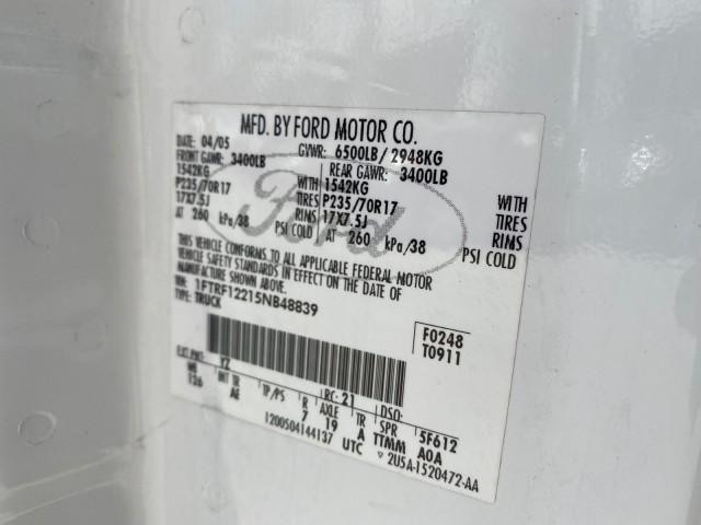 2005 Oxford White /Flint Ford F-150 PU STX LOW MILES 18,931 (1FTRF12215N) with an 4.2L EFI V6 Engine engine, Automatic transmission, located at 4701 North Dixie Hwy, Pompano Beach, FL, 33064, (954) 422-2889, 26.240938, -80.123474 - OUR WEBPAGE FLORIDACARS1.COM HAS OVER 100 PHOTOS AND FREE CARFAX LINK 2005 Ford F-150 STX Pickup 4.2L V6 F OHV Gasoline 20 MPG Rear Wheel Drive Features ABS Brakes Air Conditioning AM/FM Stereo Automatic Transmission Overhead Airbags Side Airbags Traction Control Vinyl Seats 2005 Ford F-150 STX Regu - Photo#67