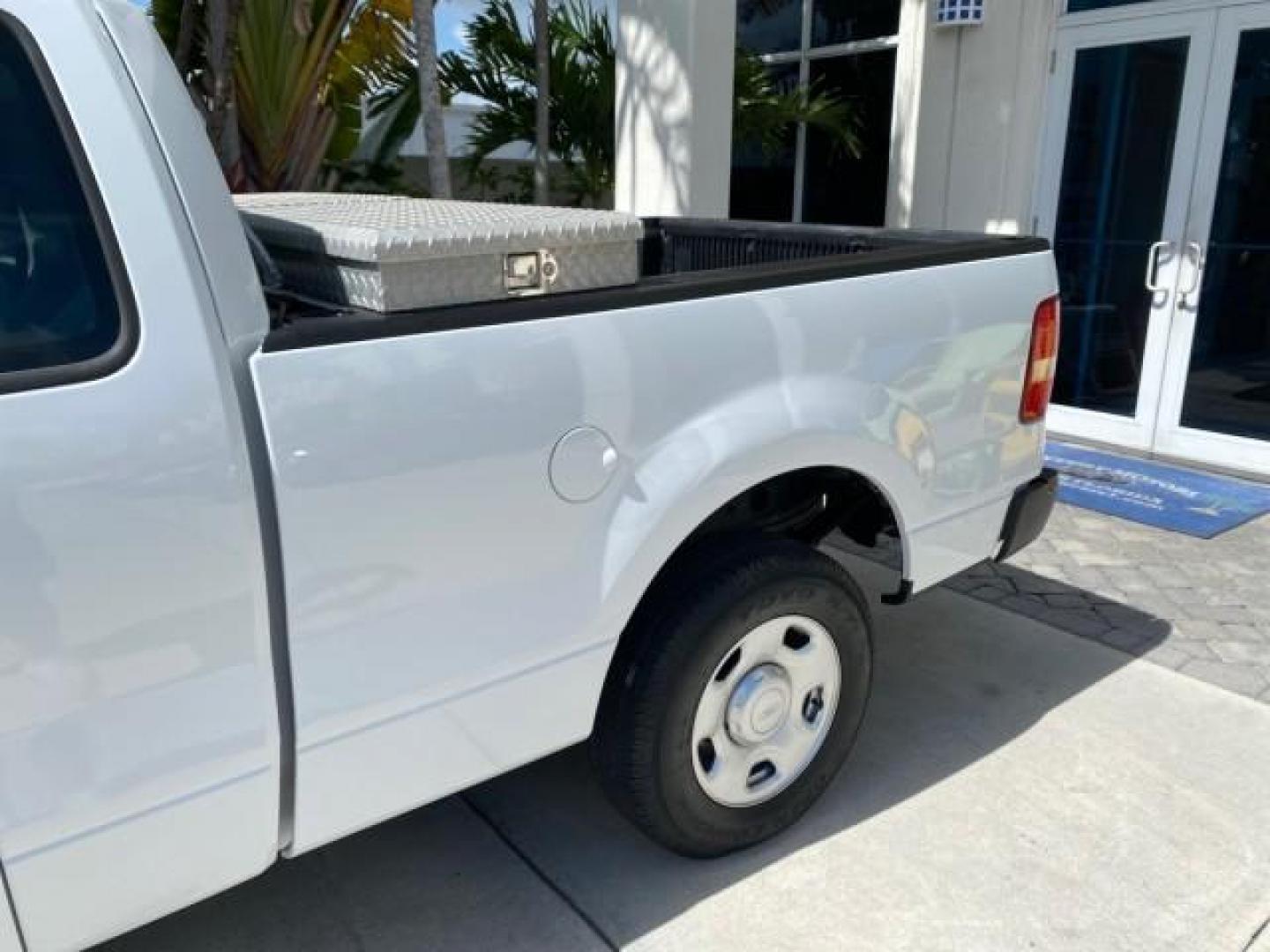 2005 Oxford White /Flint Ford F-150 PU STX LOW MILES 18,931 (1FTRF12215N) with an 4.2L EFI V6 Engine engine, Automatic transmission, located at 4701 North Dixie Hwy, Pompano Beach, FL, 33064, (954) 422-2889, 26.240938, -80.123474 - OUR WEBPAGE FLORIDACARS1.COM HAS OVER 100 PHOTOS AND FREE CARFAX LINK 2005 Ford F-150 STX Pickup 4.2L V6 F OHV Gasoline 20 MPG Rear Wheel Drive Features ABS Brakes Air Conditioning AM/FM Stereo Automatic Transmission Overhead Airbags Side Airbags Traction Control Vinyl Seats 2005 Ford F-150 STX Regu- Photo#71