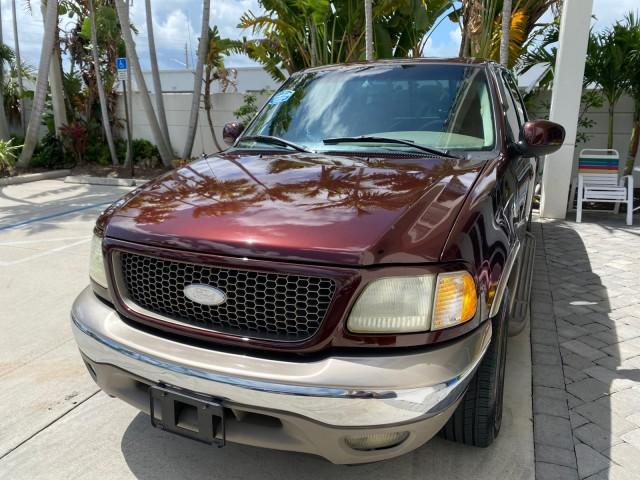2002 Toreador Red Metallic /Dark Brown Ford F-150 CREW CAB King Ranch LOW MILES 56,886 (1FTRW07L12K) with an 5.4L SEFI OHC V8 Triton Engine engine, Automatic transmission, located at 4701 North Dixie Hwy, Pompano Beach, FL, 33064, (954) 422-2889, 26.240938, -80.123474 - OUR WEBPAGE FLORIDACARS1.COM HAS OVER 100 PHOTOS AND FREE CARFAX LINK 2002 Ford F-150 King Ranch Crew Pickup 5.4L V8 F SOHC 16V Gasoline 19 MPG Rear Wheel Drive Features ABS Brakes Air Conditioning Alloy Wheels AM/FM Stereo Automatic Transmission Bed Liner Cassette Player Cruise Control Leather Seat - Photo#3