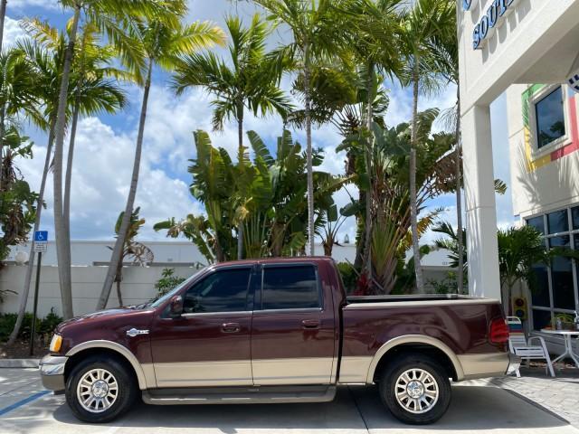 2002 Toreador Red Metallic /Dark Brown Ford F-150 CREW CAB King Ranch LOW MILES 56,886 (1FTRW07L12K) with an 5.4L SEFI OHC V8 Triton Engine engine, Automatic transmission, located at 4701 North Dixie Hwy, Pompano Beach, FL, 33064, (954) 422-2889, 26.240938, -80.123474 - OUR WEBPAGE FLORIDACARS1.COM HAS OVER 100 PHOTOS AND FREE CARFAX LINK 2002 Ford F-150 King Ranch Crew Pickup 5.4L V8 F SOHC 16V Gasoline 19 MPG Rear Wheel Drive Features ABS Brakes Air Conditioning Alloy Wheels AM/FM Stereo Automatic Transmission Bed Liner Cassette Player Cruise Control Leather Seat - Photo#4